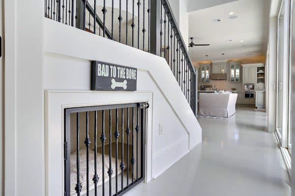 dog room under the stairs with gate