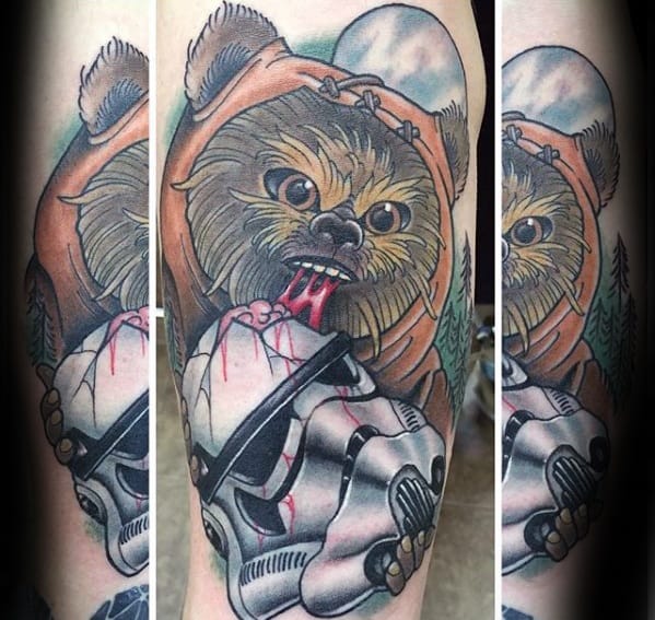 Vivid Ewok tattoo with bloodied mouth biting a Stormtrooper helmet, set against a moonlit forest background.