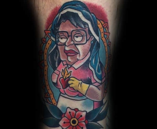 Tattoo of Consuela from Family Guy depicted in a religious-style portrait, wearing a veil, holding a flaming heart, and framed with floral details.