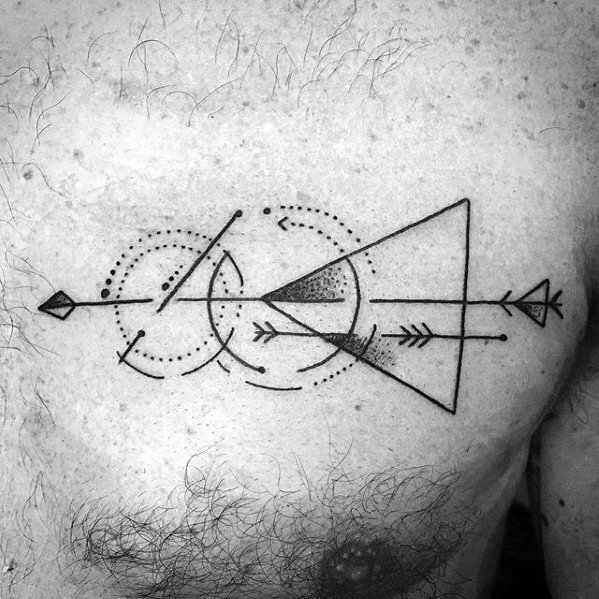 Chest tattoo featuring a geometric arrow with bold triangles, dotted circles, and abstract lines forming a modern symmetrical design.