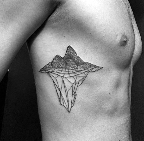 Geometric mountain and iceberg tattoo on the ribcage, with fine lines creating a 3D floating landmass effect.