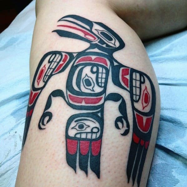 Awesome Haida Tribal Bird Red And Black Ink Leg Tattoo