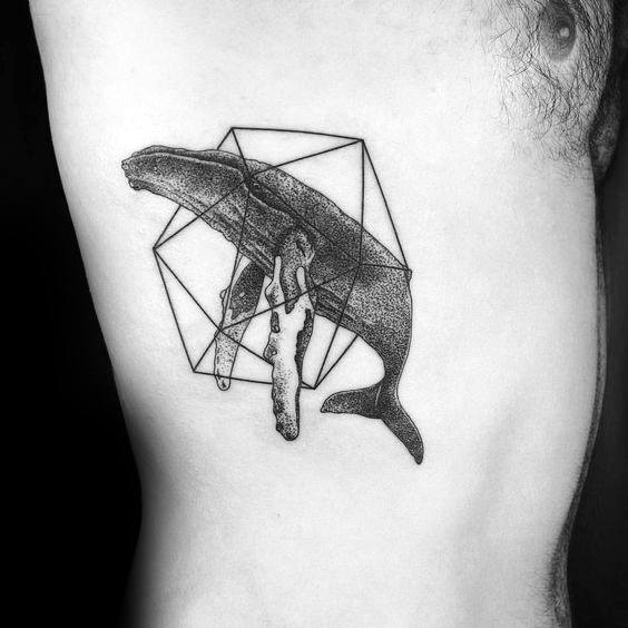 Whale and icosahedron tattoo on ribcage blending realism with geometric lines and surreal dripping effect.