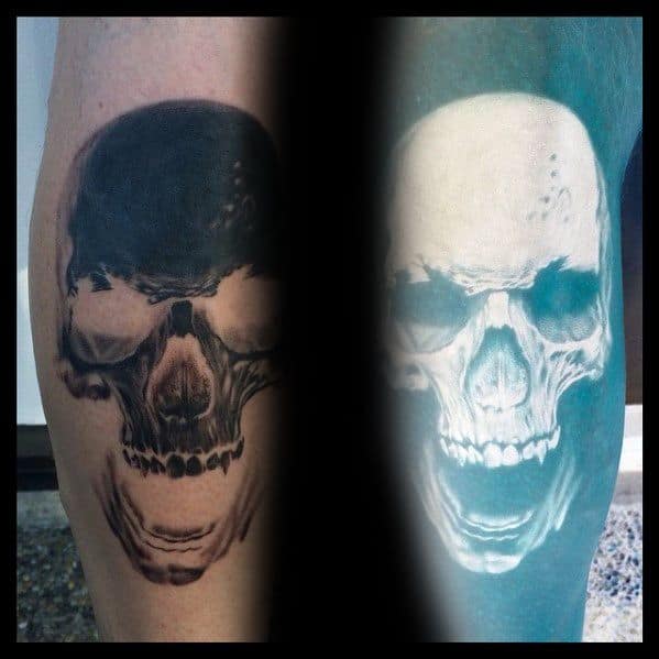 Inverted skull tattoo design showing dark-to-light contrast, revealing a haunting face with detailed shadows and highlights.