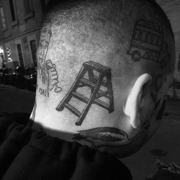 Bold, minimalistic ladder tattoo inked behind the ear, part of a creative blackwork head tattoo design for men.