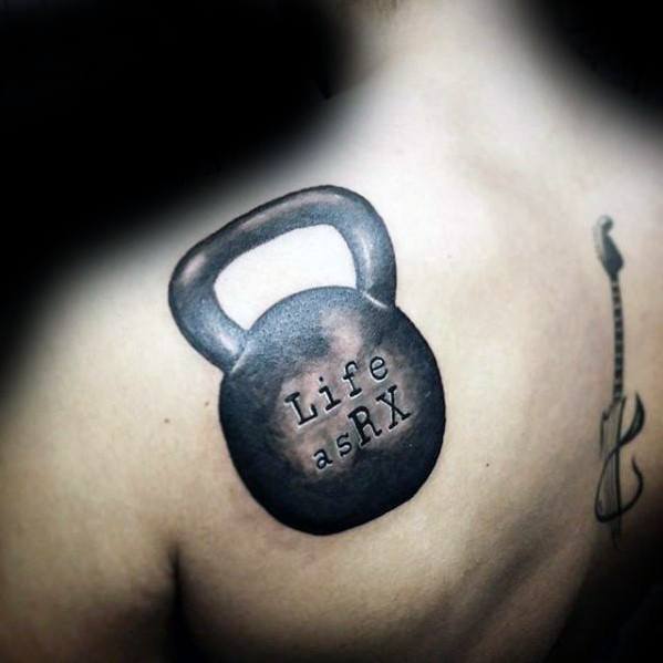 Realistic kettlebell tattoo on the shoulder with "Life as RX" text, symbolizing strength, dedication, and the CrossFit lifestyle.