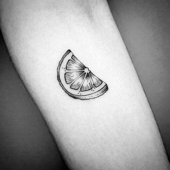 Minimalist black ink lime wedge tattoo with fine line detailing, creating a simple yet stylish citrus-inspired design on the skin.