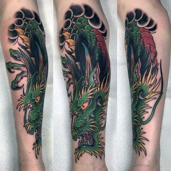 Tattoo of a detailed, colorful dragon wrapped around an arm
