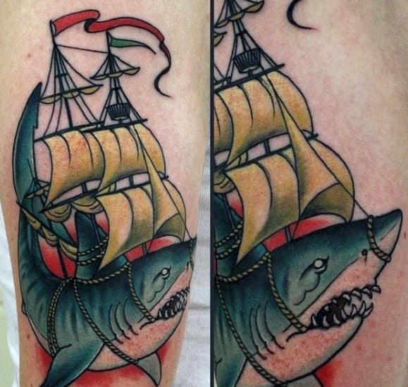 Neo-traditional tattoo of a shark fused with a sailing ship, featuring bold lines, gold sails, and vibrant red shading.