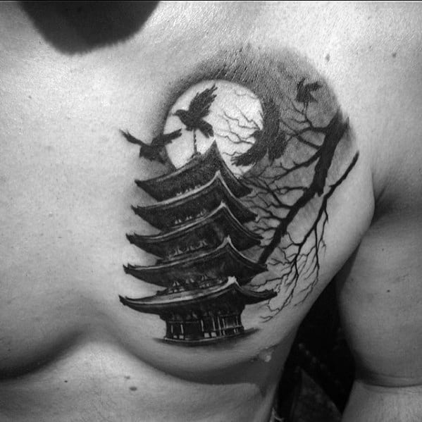 Black and grey chest tattoo of a pagoda with a full moon, flying birds, and leafless tree branches for a dramatic nighttime scene.