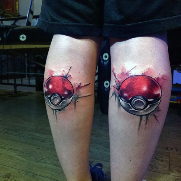 Matching 3D Pokeball tattoos on both calves with red and black ink, splatter effects, and dynamic shading for a bold look.
