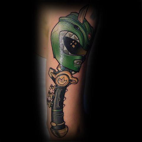 Green Ranger helmet tattoo with the iconic Dragon Dagger, featuring bold outlines, metallic tones, and a dynamic vertical layout.