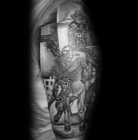Black and grey tattoo of a rodeo cowboy riding a bucking horse, capturing motion and intensity with fine shading and realistic details.