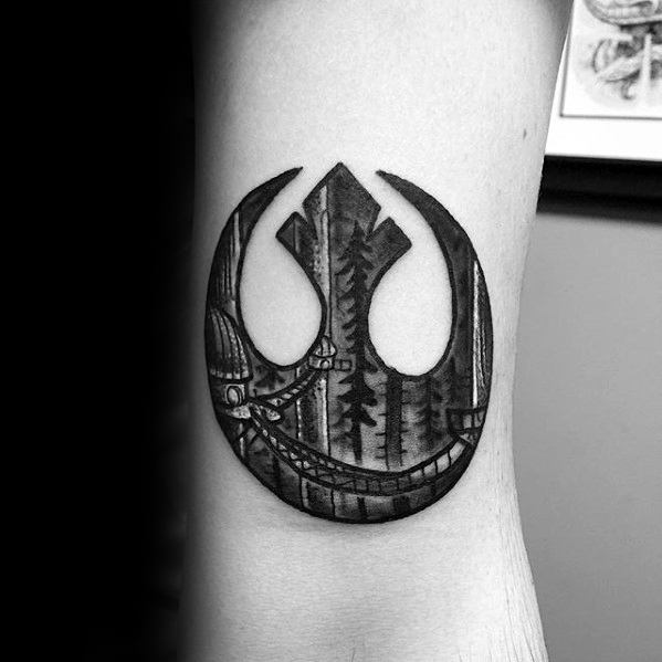 Rebel Alliance tattoo on the forearm, featuring a forest scene with an AT-AT walker in the background.