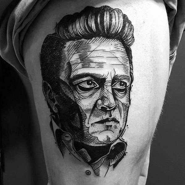 Black and white tattoo of Johnny Cash's face