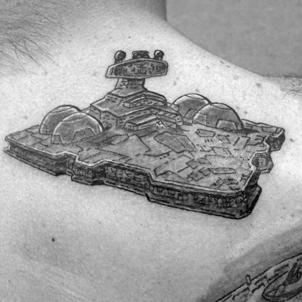 Detailed Star Destroyer tattoo on upper back, featuring sharp lines and bold shading for a 3D sci-fi effect.
