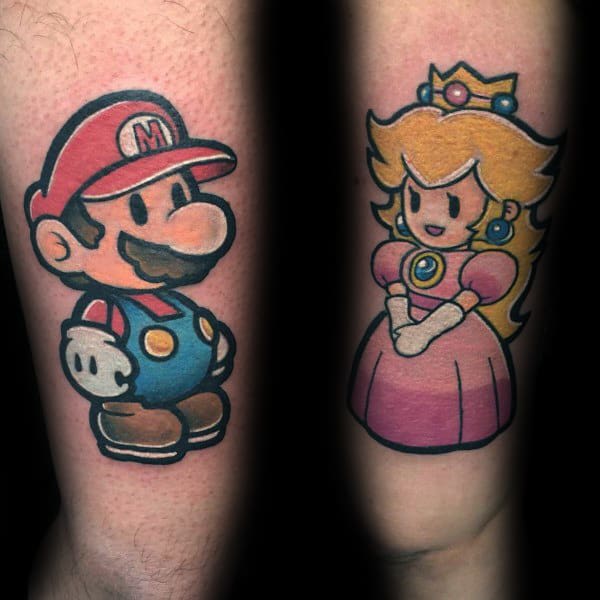 Colorful matching tattoos of Mario and Princess Peach, symbolizing a fun and playful couple connection through classic gaming.
