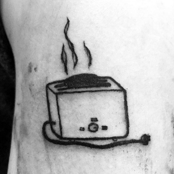 Minimalist toaster tattoo with steam rising, featuring a simple black outline and shading. The unplugged cord adds a unique touch to the design.