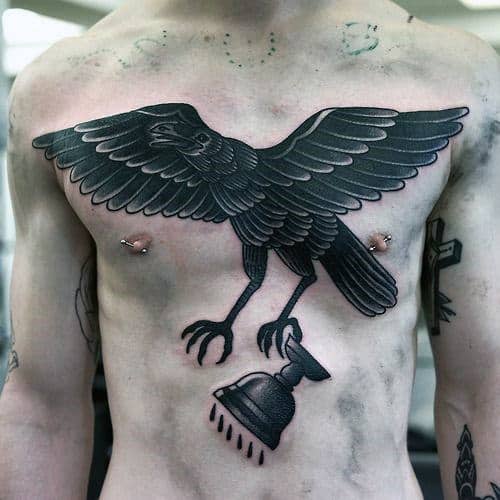 Awesome Traditional Crow Flying With Cup Mens Chest Tattoo