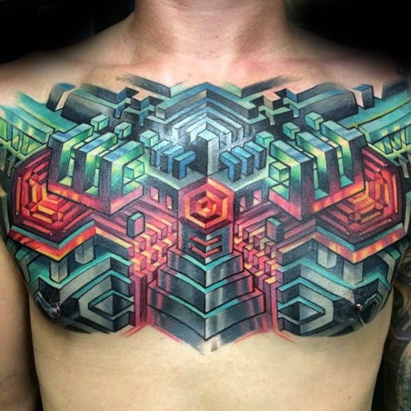 Bold geometric chest tattoo with 3D maze-like patterns in red, green, and blue tones forming a symmetrical, futuristic design.