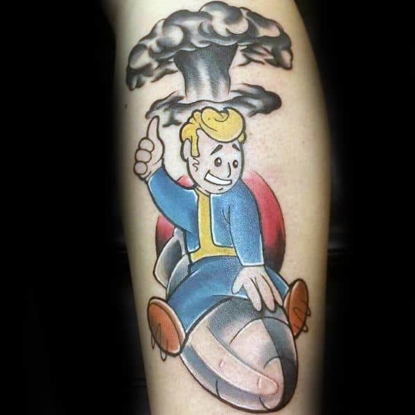 Vault Boy tattoo riding a bomb with a thumbs-up, under a black mushroom cloud in a bold, cartoon-style Fallout tribute.