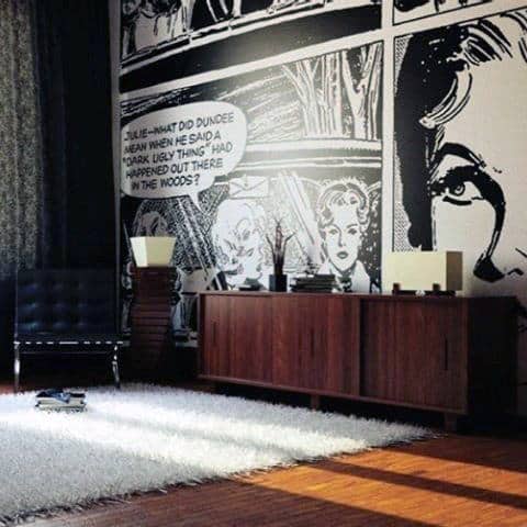 Living room with comic book-style wallpaper, wood sideboard, black chair, and white rug.