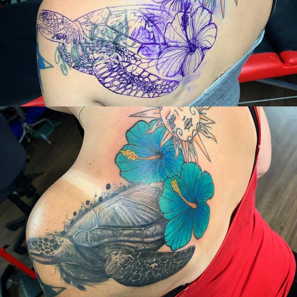 Back tattoo featuring a detailed sea turtle with vibrant blue hibiscus flowers and a sun design