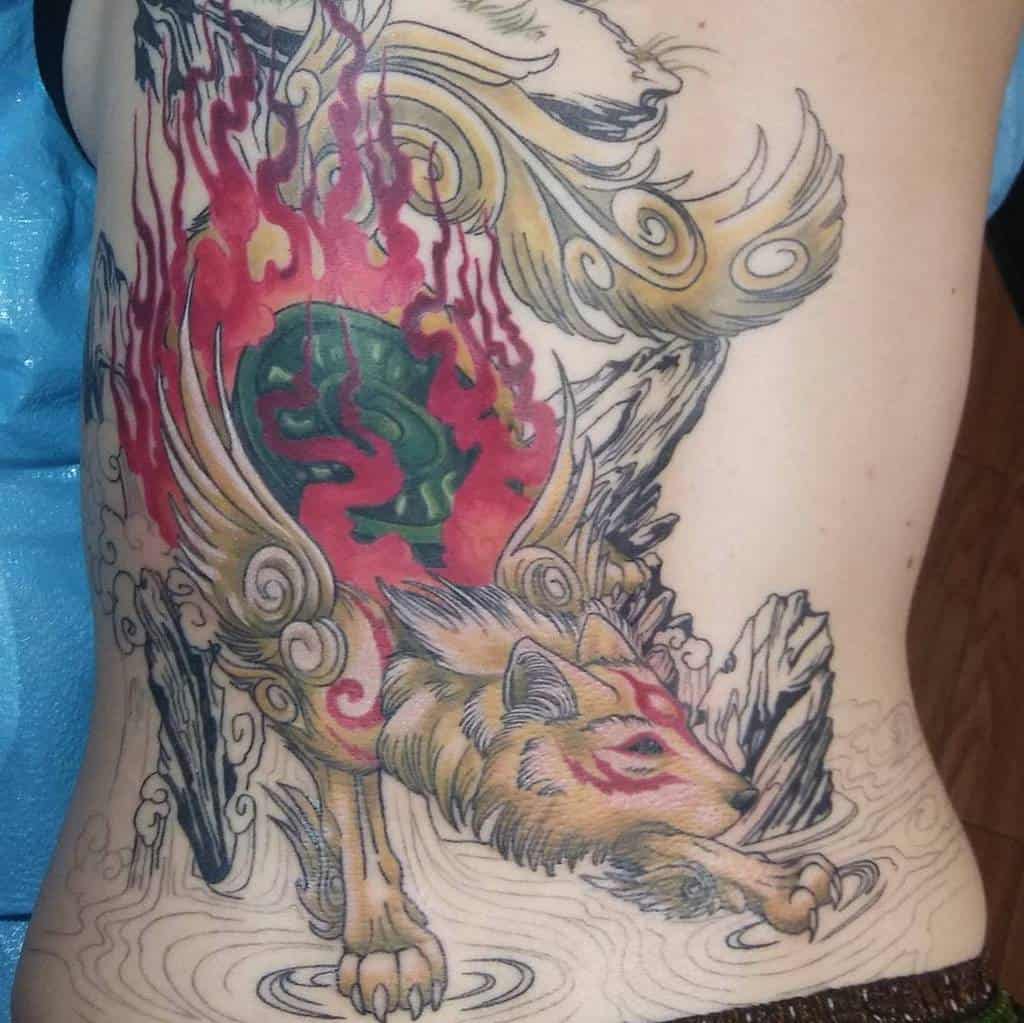 Japanese-style wolf tattoo with swirling flames and intricate designs, covering the side of the body