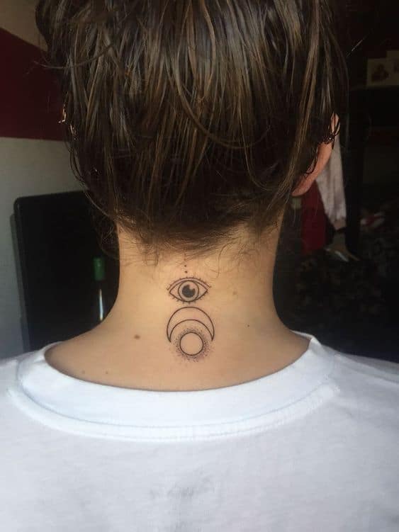 Minimalist tattoo of an all-seeing eye above crescent and full moon symbols, inked in fine black lines on the back of the neck.
