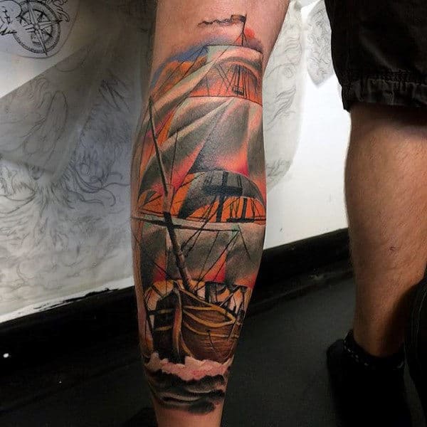 Back Of Legs Ship Wheel And Anchor Tattoo On Man