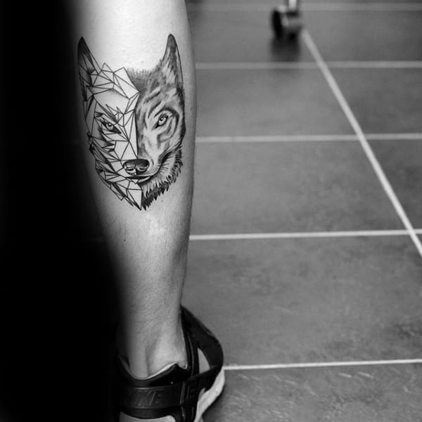 Back Of Leg Calf Man With Tattoo Of Geometric Wolf