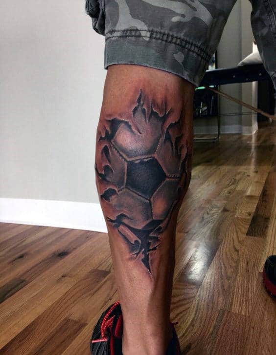 Back Of Leg Calf Soccerball Torn Skin Tattoo For Guys