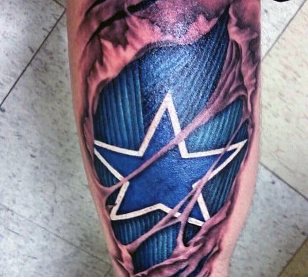 3D ripped skin tattoo revealing a textured blue background with a white-outlined star, creating a bold layered illusion on the leg.