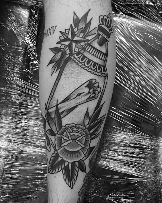 Blackwork tattoo of a message in a bottle adorned with a crown, flowers, and bold linework
