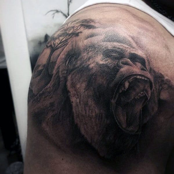 Back Of Shoulder Gorilla With Tree Tattoo On Back Of Mans Shoulder