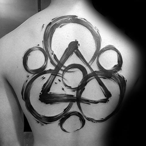 Large Keywork tattoo across the back with bold black brushstroke style, symbolizing Coheed and Cambria’s iconic emblem.