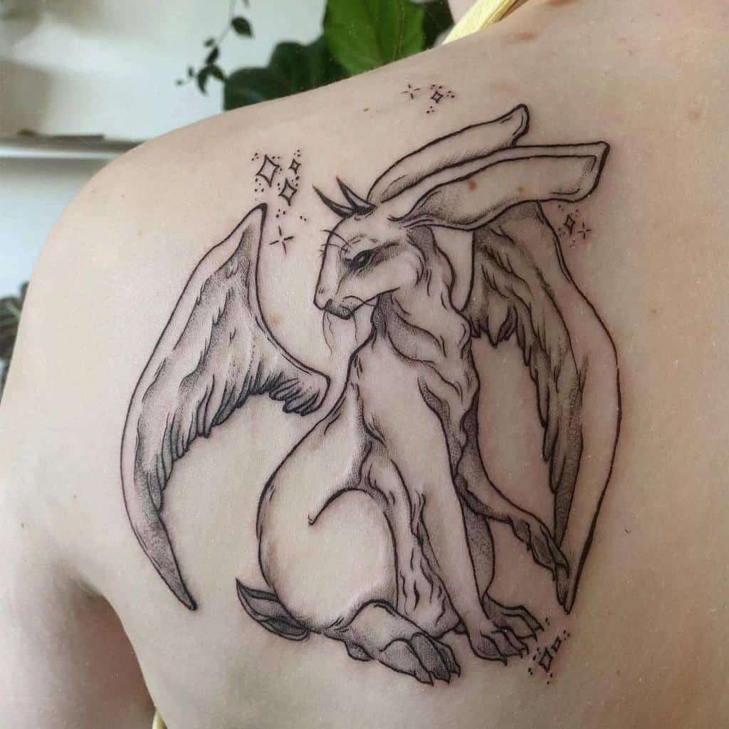 Intricate tattoo of a winged rabbit, ethereal wings, surrounded by small stars and celestial symbols