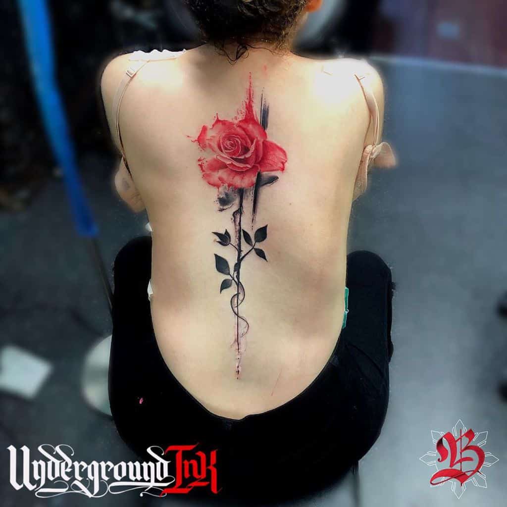 Large red rose tattoo on the back