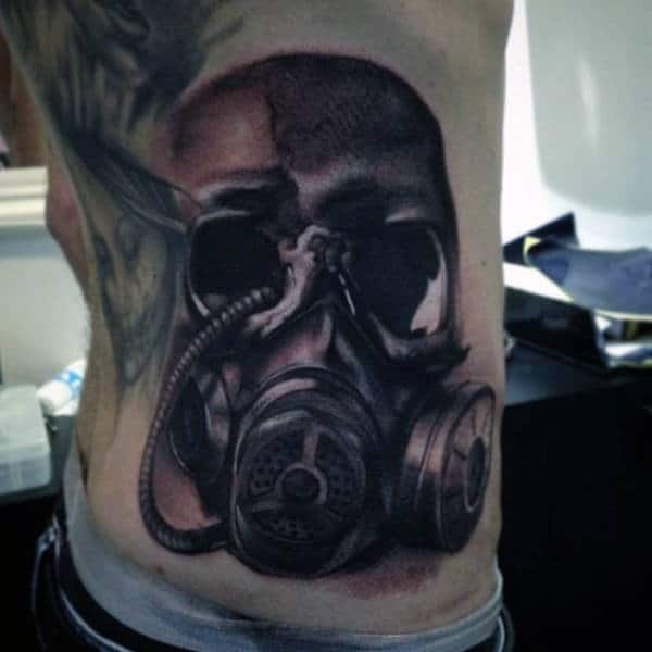 Back Side Rib Cage Gas Mask Tattoo On Man
