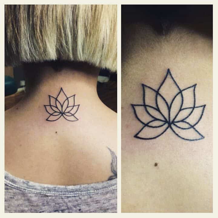 Simple lotus flower tattoo on the back of a neck
