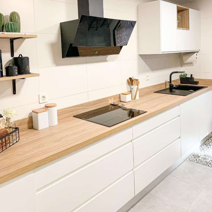 large white backsplash kitchen tiles white cabinets wood countertop