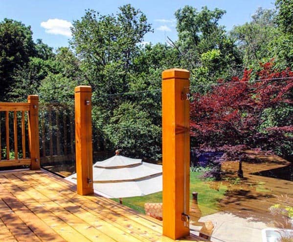 backyard deck railing wood posts with glass