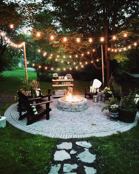 backyard fire pit circle patio string light design