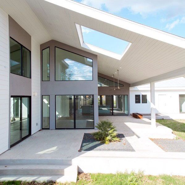 luxury home with massive white wood pergola with skylight 