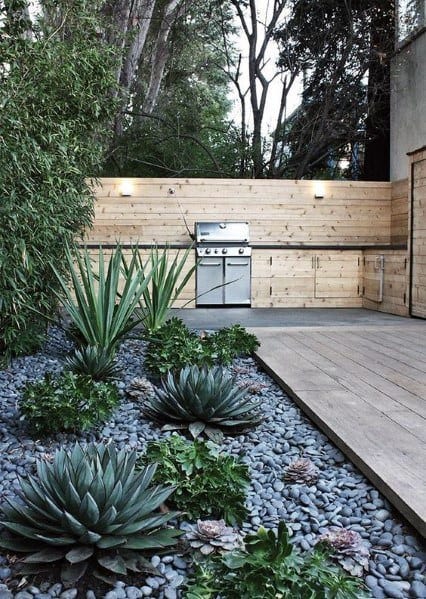 wood deck with concrete patio bbq stone garden with succulents 