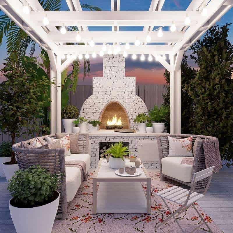 deck patio with white pergola and fireplace 