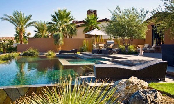 luxury pool oasis backyard wicker sun loungers 