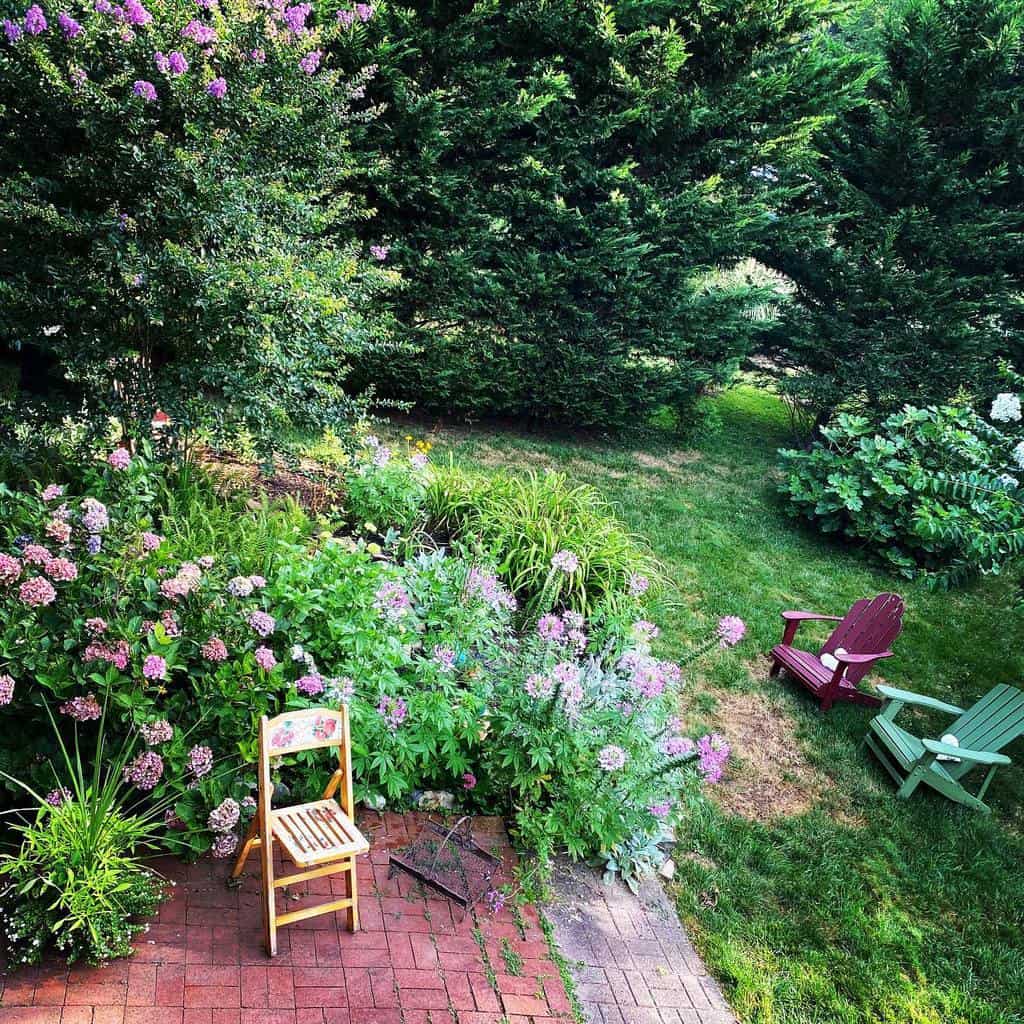 large green garden with brick patio