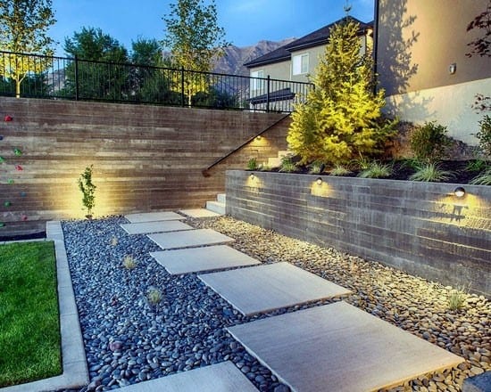 concrete steps with landscaping pebbles 