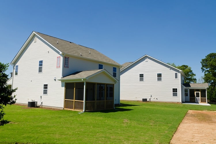 screened-in porch with wood accents
